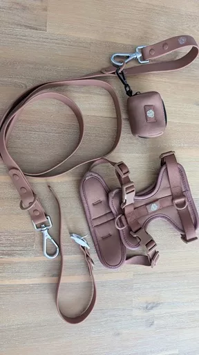Full set flat lay of The Furry Nomad Chocolate Brown walk kit including padded harness, multi-way lead, collar, and waste bag holder.